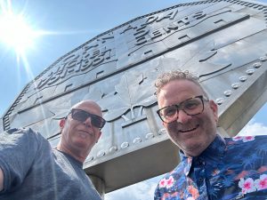 Glen and Tm selfie in front of the Big Nickel