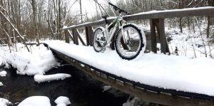 White Rocky Mountain Blizzard hardtail Fat Bike on a snowy bridge