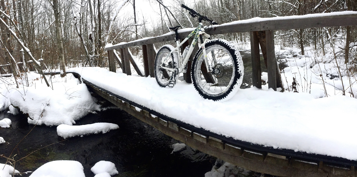 White Rocky Mountain Blizzard hardtail Fat Bike on a snowy bridge