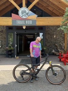 Tim admiring the Orbea Occam in front of the Trail Hub Shop