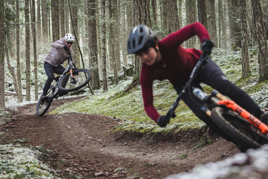 2 Mountain bikers Shredding down the trail. Fuelled by Xact Nutrition.